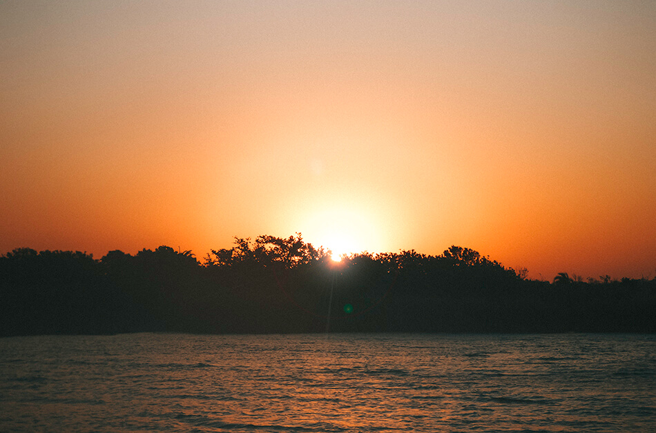 Enjoying an evening cruise searching for hippos in St Lucia, South-Africa