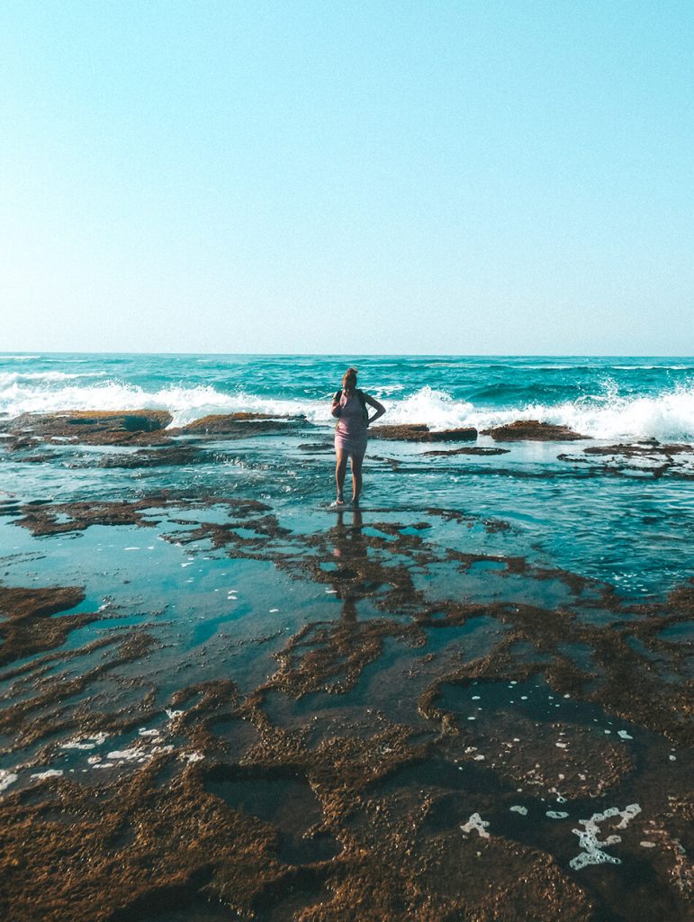 Searching for sealife between the Mission Rock Pools of Isimangaliso Wetland Park in St Lucia, South-Africa