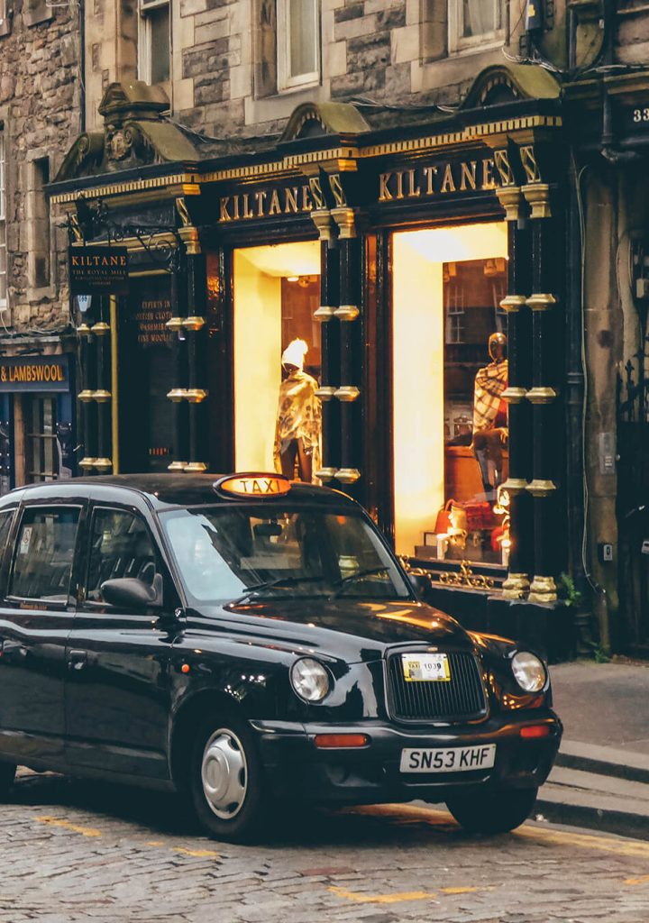 The Royal Mile is ligned with shops and the occasional black cabs