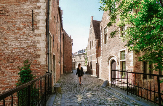 Strolling through narrow streets and old buildings in the Grand-Beguinage Leuven, Belgium