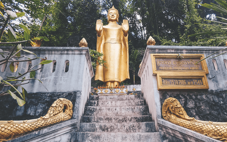 Golden statues adorn Phousi Hill in Luang Prabang, Laos