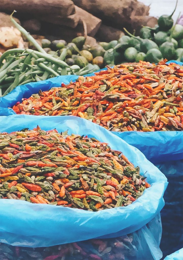 Dried peppers and other foods are being sold at the morning market in Luang Prabang, Laos