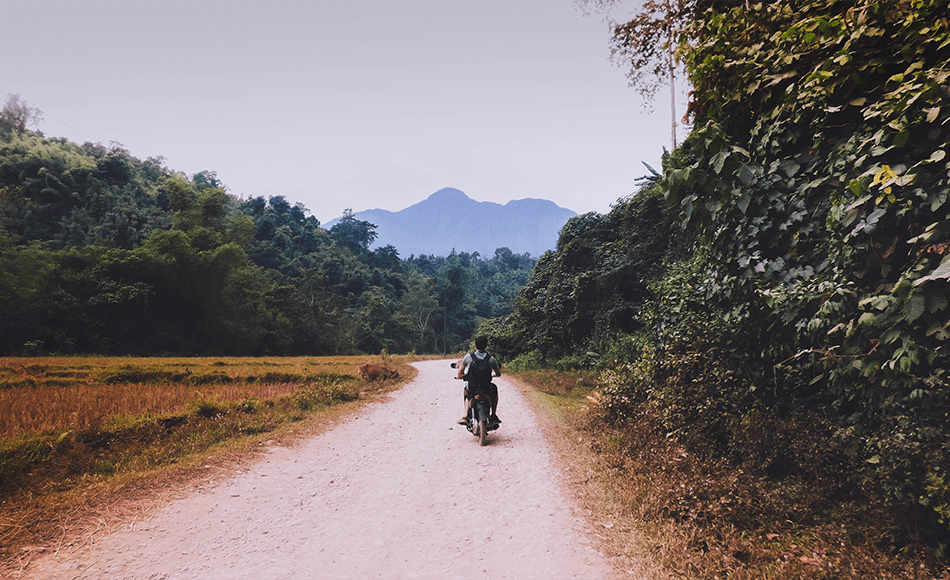 Motorbiking through local villages in Vang Vieng