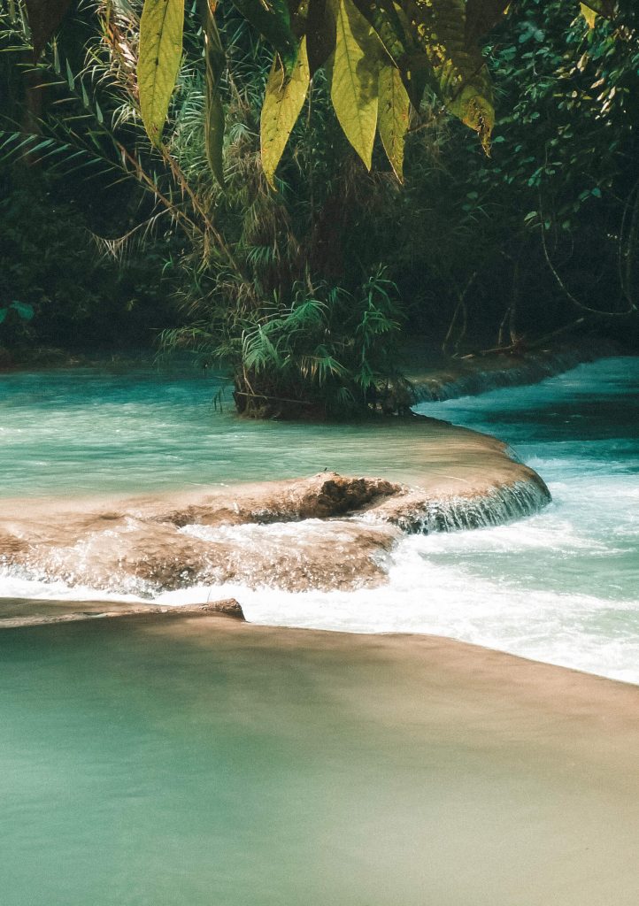 Cascading turquoise pools as far as the eye can see at Kuang-Si Falls