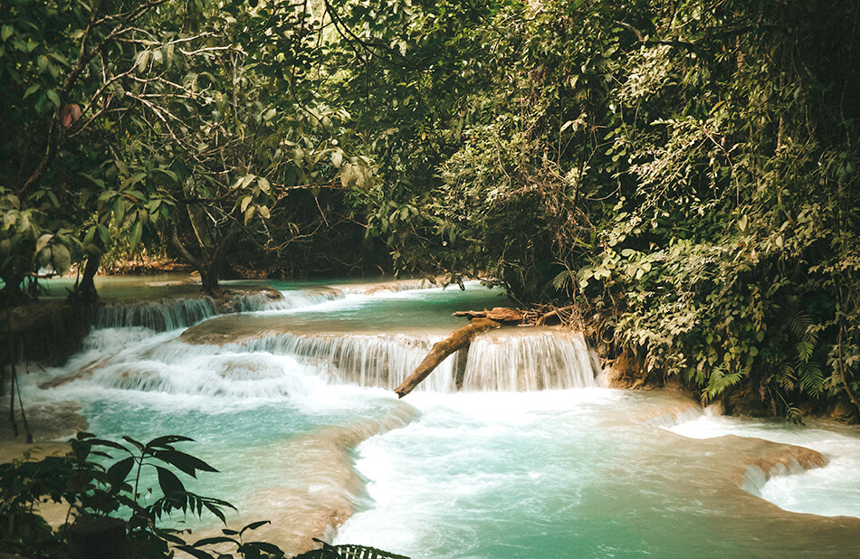 Cascading turquoise pools as far as the eye can see at Kuang-Si Falls