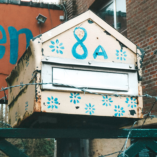 Mailboxes and properties are surrounded by barbed wire