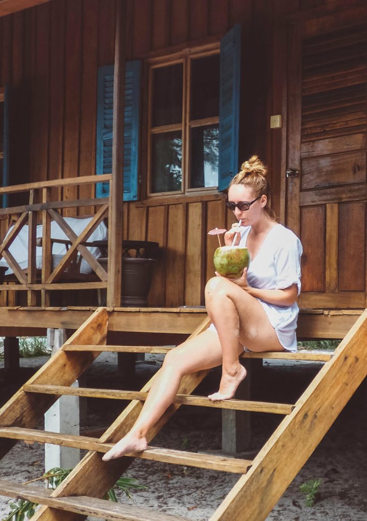 Sippin a coconut on the porch of our bungalow at Sok San Beach Resort