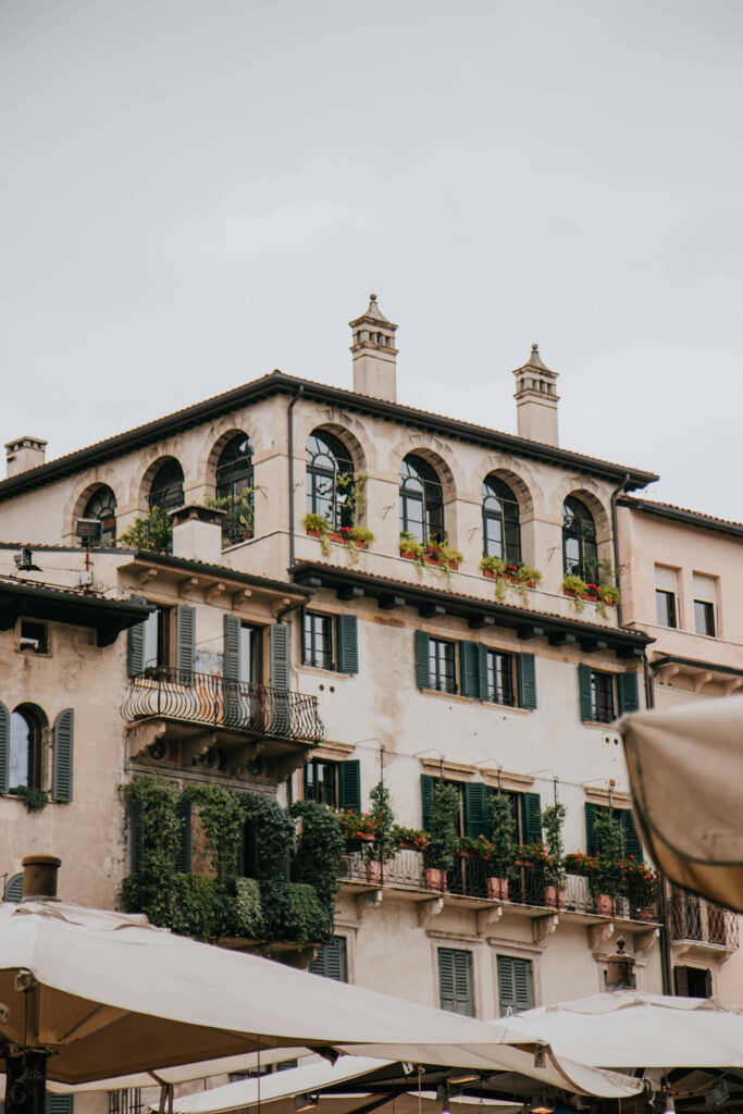 Beautiful houses with balconies surrounding Piazza delle Erbe