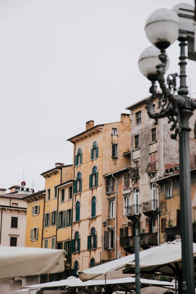 Beautiful houses with balconies surrounding Piazza delle Erbe