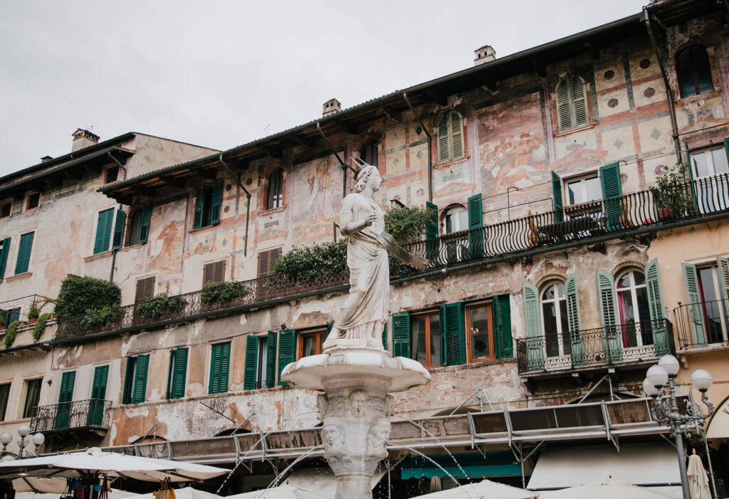 Beautiful houses and fountain at Piazza delle Erbe