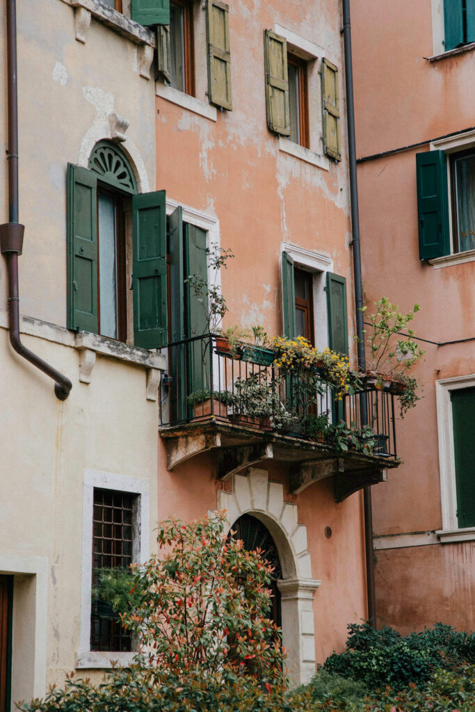 Old pink crumbling house in Verona's City Centre