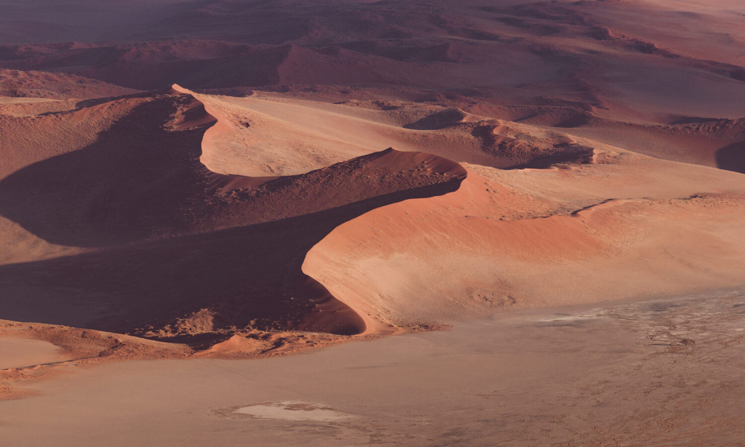 The Namib dune ridges look like dragon spines while viewing from a hot air balloon above the Sossusvlei