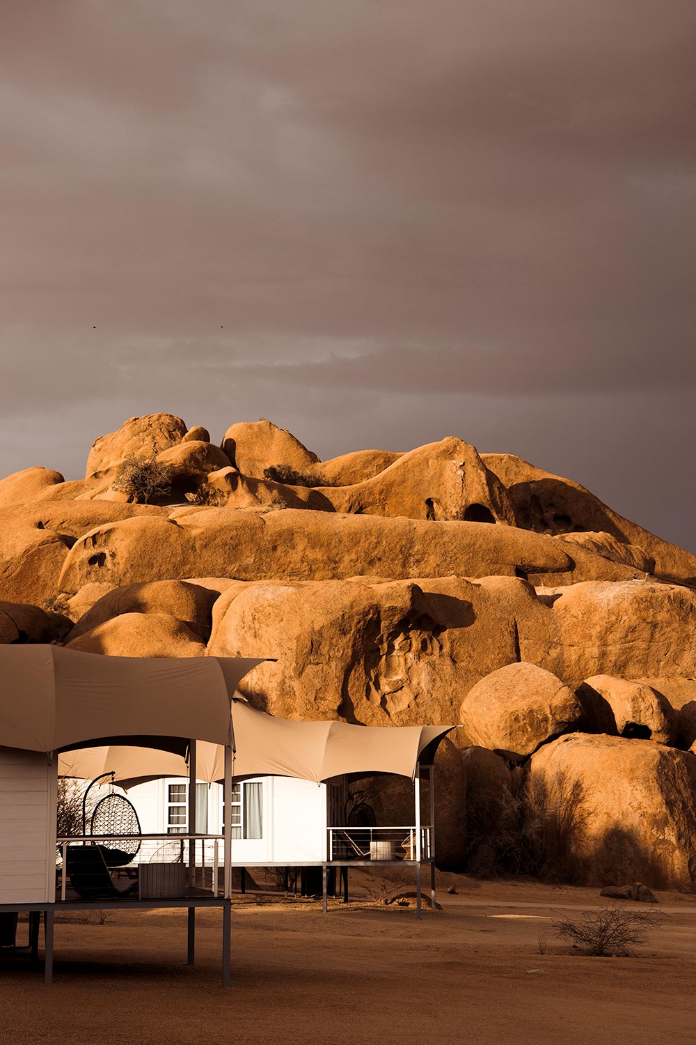 The boho chic clamping accommodations among the golden lit boulders of Spitzkoppe Mountain