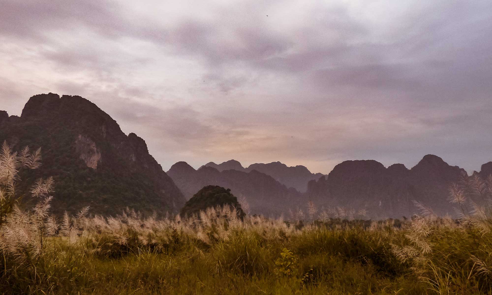 Sunset veins over Vang Vieng limestone cliffs, one of the best places to visit in Laos to admire the sunset