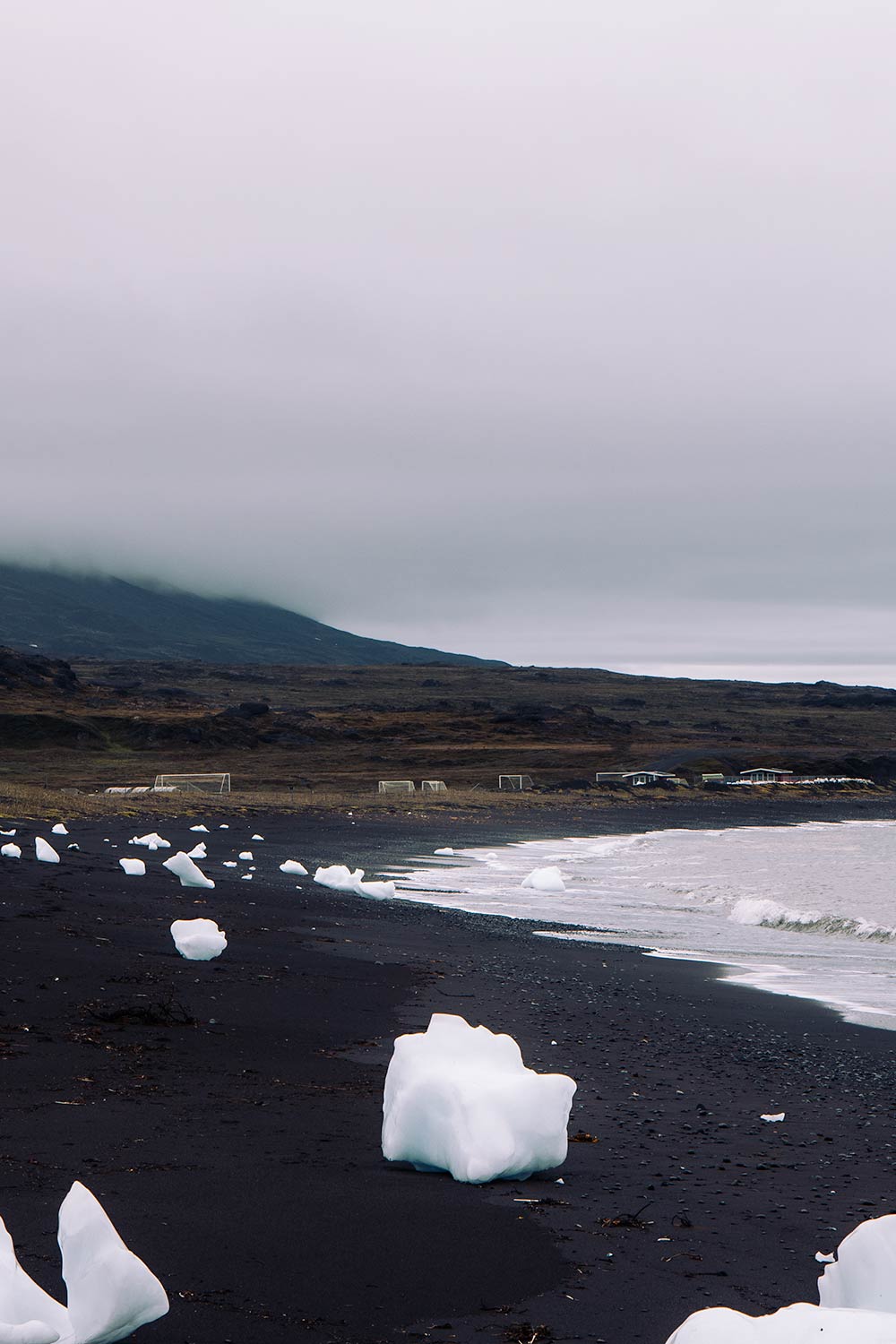 Black sand beach on Disko Island is perfect for whale watching